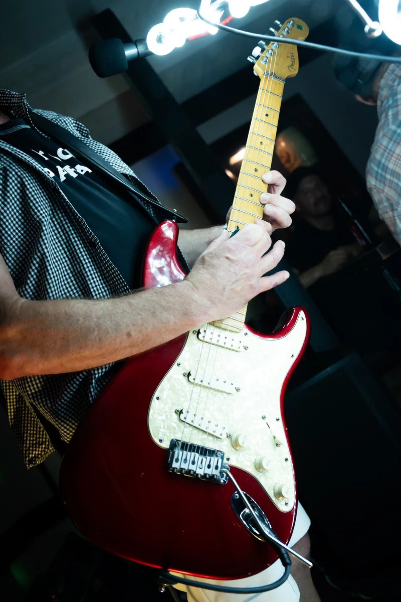 Close-up of a guitarist playing at The Dickens