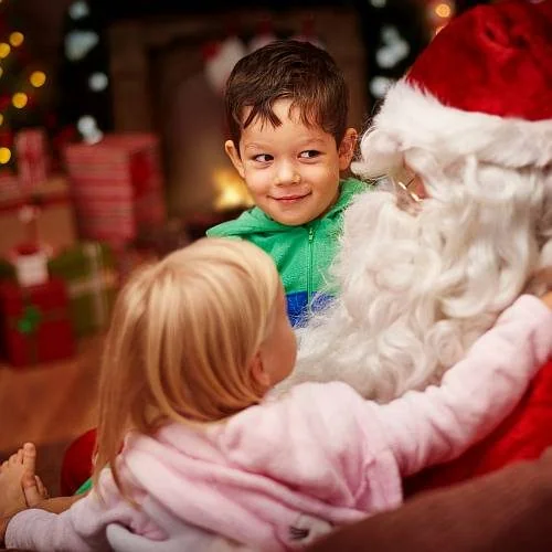 Children enjoying a visit with Santa